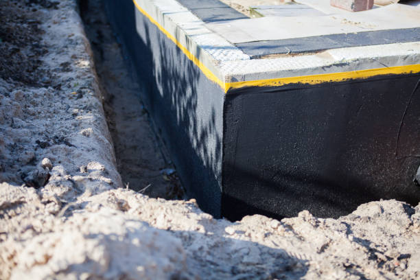 Professional Waterproofing technician working in Montezuma, OH
